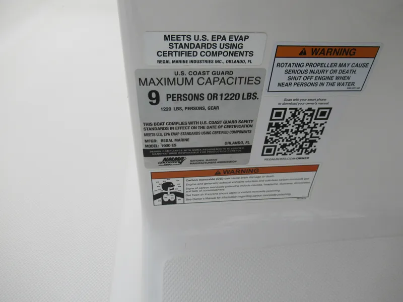 Slide: The Image of 2019 Regal 1900 ES Bowrider capacity and safety warning labels. - 14