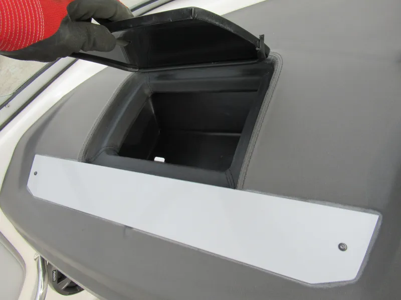 Slide: The Image of 2019 Regal 1900 ES Bowrider storage compartment with open lid. - 15