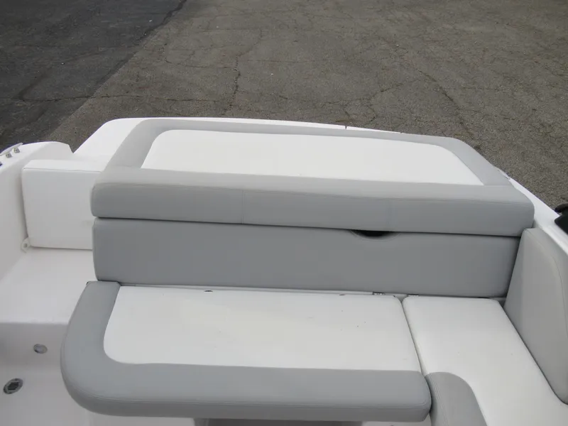 Slide: The Image of 2019 Regal 1900 ES Bowrider rear seating area with gray and white upholstery. - 20