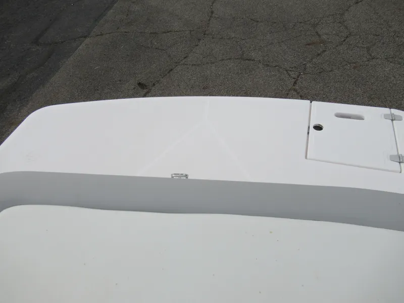 Slide: The Image of 2019 Regal 1900 ES Bowrider boat deck with white finish. - 22