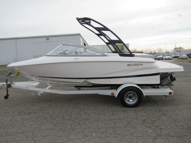 Slide: The Image of 2019 Regal 1900 ES Bowrider on a trailer in a parking lot. - 4