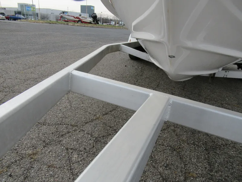 Slide: The Image of 2019 Regal 1900 ES Bowrider on a boat trailer, close-up view. - 7