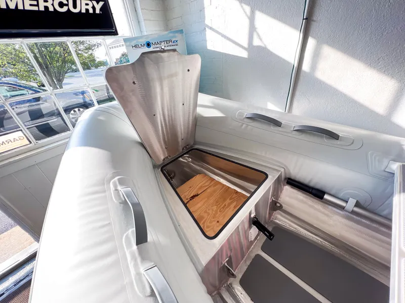 Slide: The Image of 2023 AB Inflatables 9.5 Lammina AL boat interior with open storage compartment. - 6