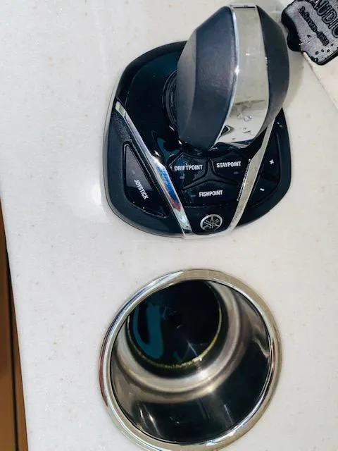 Slide: The Image of Joystick control on a 2021 Cobia 330 Dual Console boat. - 30