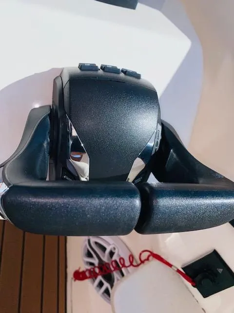 Slide: The Image of Throttle controls on a 2021 Cobia 330 Dual Console boat. - 31
