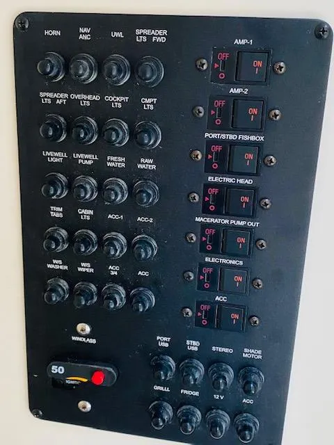 Slide: The Image of Control panel of a 2021 Cobia 330 Dual Console boat. - 41