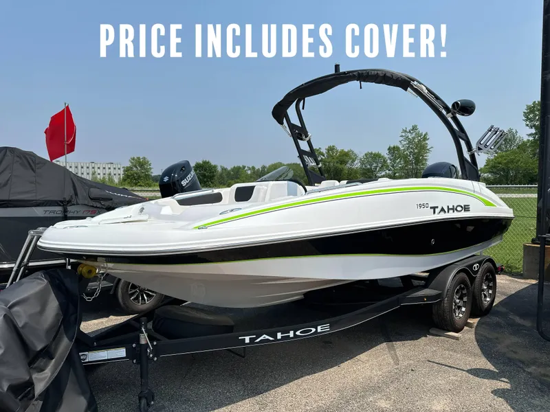 Slide: The Image of 2023 Tahoe 1950 boat on trailer, includes cover, white and green design, outdoor setting. - 1