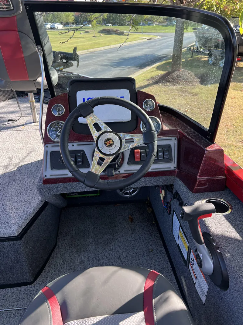 Slide: The Image of 2023 Ranger VS1782SC Angler boat cockpit with steering wheel and control panel. - 5