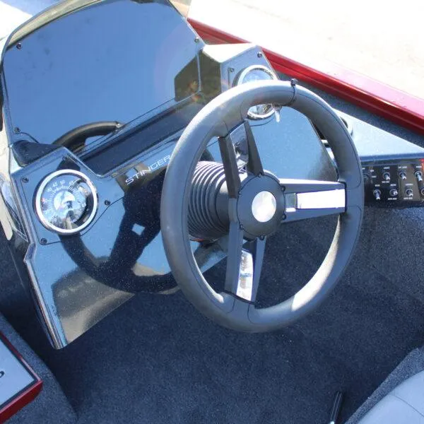 Slide: The Image of 2023 Lowe ST188 boat steering console with gauges and controls. - 6