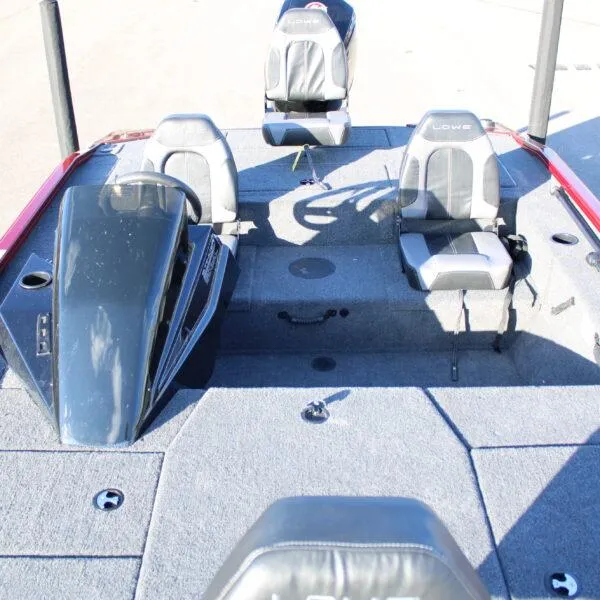 Slide: The Image of 2023 Lowe ST188 fishing boat interior with three seats and steering console. - 7