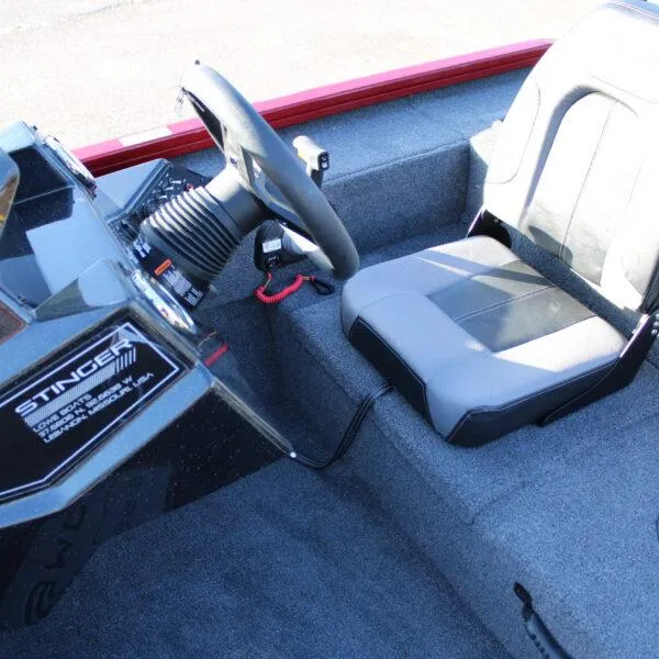 Slide: The Image of 2023 Lowe ST188 boat cockpit with steering wheel and seat. - 9