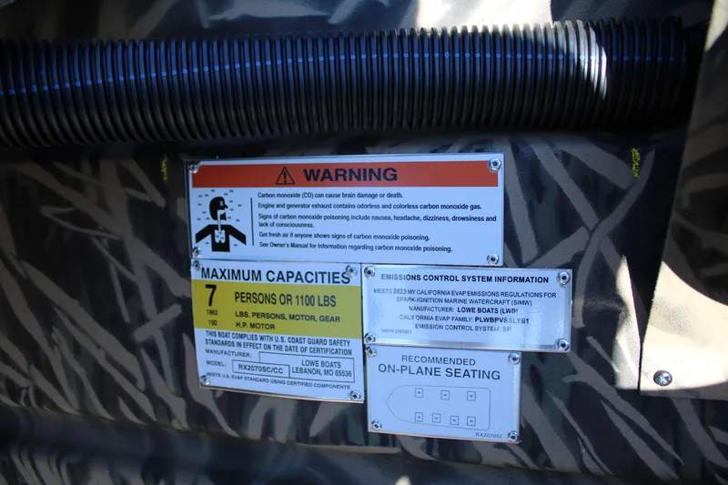 Slide: The Image of 2023 Lowe RX 2070 SC boat warning and capacity labels. - 6