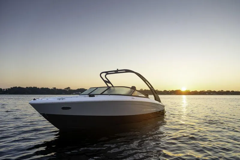 Slide: The Image of 2025 Regal LS2 boat on water at sunset. - 1