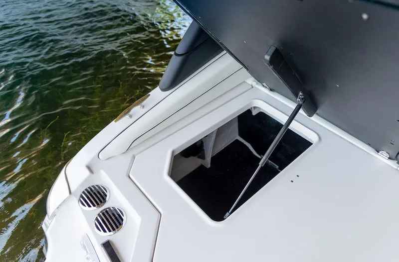 Slide: The Image of 2025 Regal LS2 boat storage compartment with open hatch. - 10