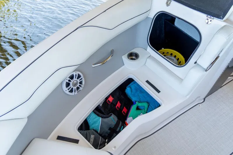 Slide: The Image of 2025 Regal LS2 boat interior storage compartments and seating area. - 6