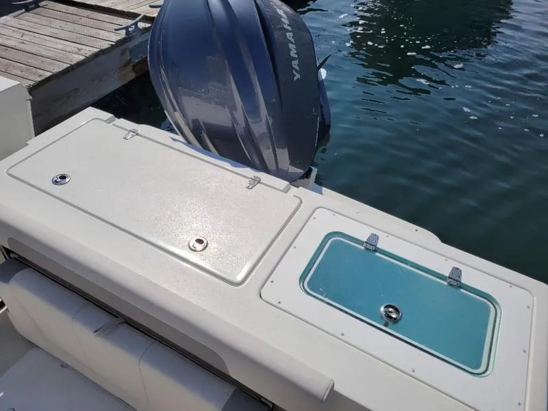 Slide: The Image of 2023 Parker 2500 SE boat with Yamaha outboard engine at dock. - 4