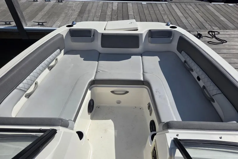 Slide: The Image of 2023 Bayliner DX 2200 boat interior with spacious seating and modern design. - 9