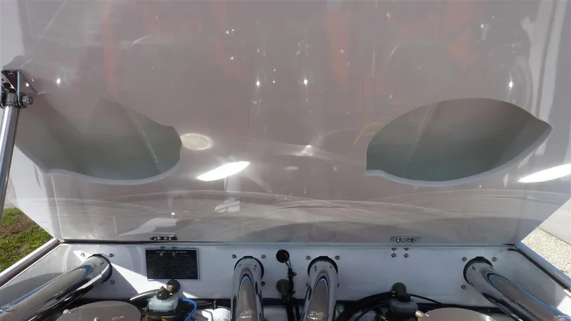 Slide: The Image of 1971 Magnum Sport engine bay with open hood, showcasing engine components. - 16