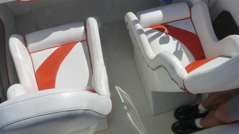 Slide: The Image of 1971 Magnum Sport boat seats with white and orange upholstery. - 9