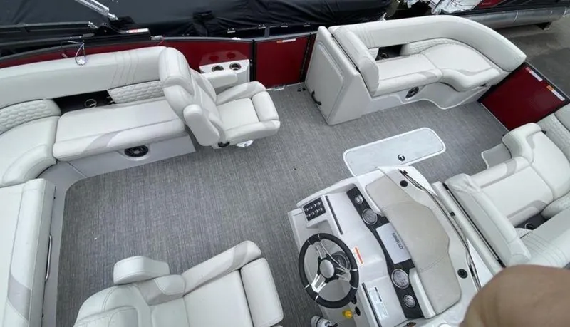 Slide: The Image of 2023 Crest Caribbean LX 230 SLS interior with luxurious seating and modern helm. - 4