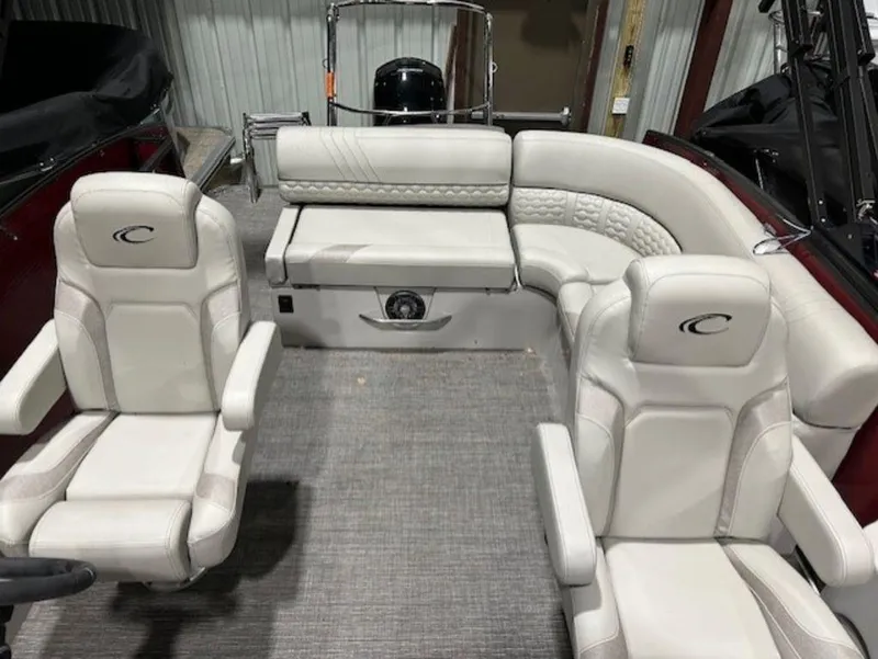 Slide: The Image of 2023 Crest Caribbean LX 230 SLS boat interior with white leather seats and gray carpet. - 6
