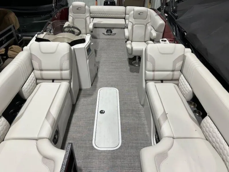 Slide: The Image of 2023 Crest Caribbean LX 230 SLS interior with luxurious white seating and spacious layout. - 7