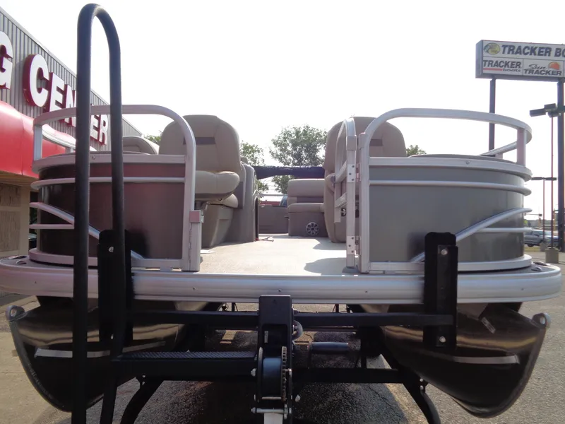 Slide: The Image of 2023 Sun Tracker Fishin' Barge 20 DLX pontoon boat on trailer. - 6