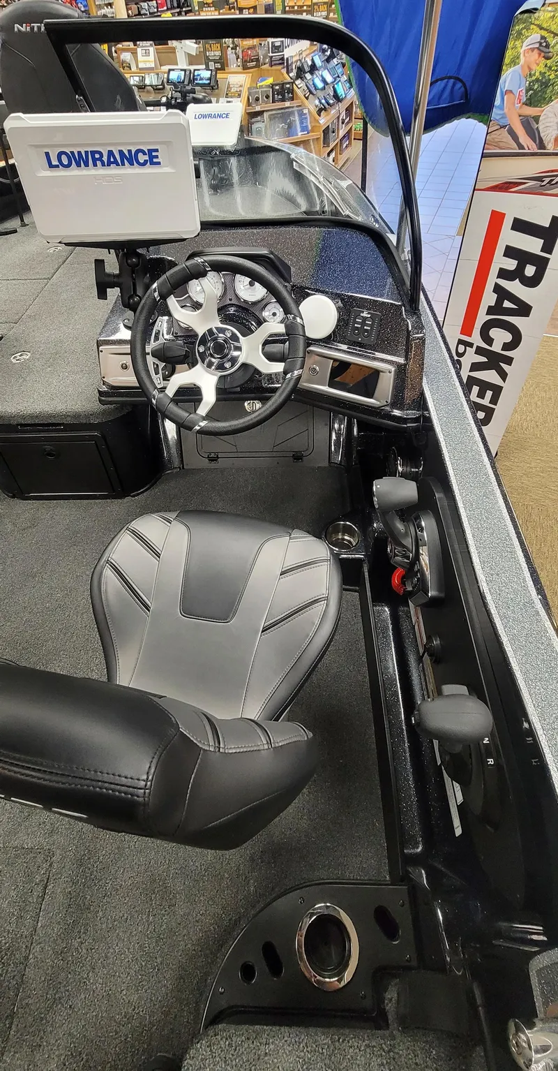 Slide: The Image of Nitro ZV20 Pro 2023 boat cockpit with Lowrance navigation system and comfortable seating. - 7
