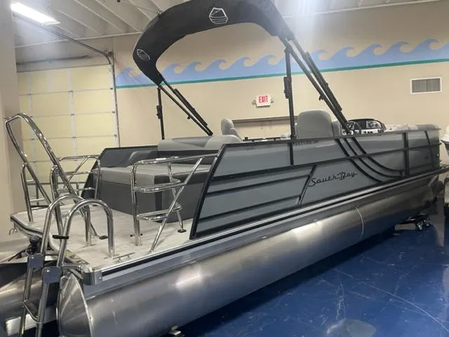 The Image of 2023 South Bay 224 UL 3.0 pontoon boat in showroom. - 0