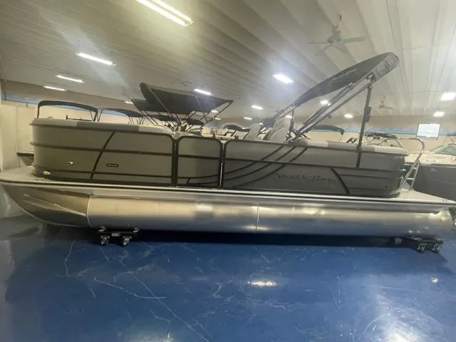 Slide: The Image of 2023 South Bay 224 UL 3.0 pontoon boat in showroom. - 2