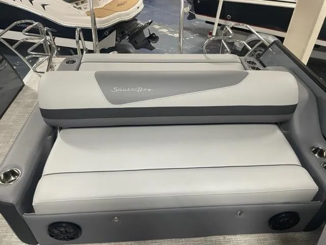 Slide: The Image of 2023 South Bay 224 UL 3.0 boat with gray seating and cup holders. - 4
