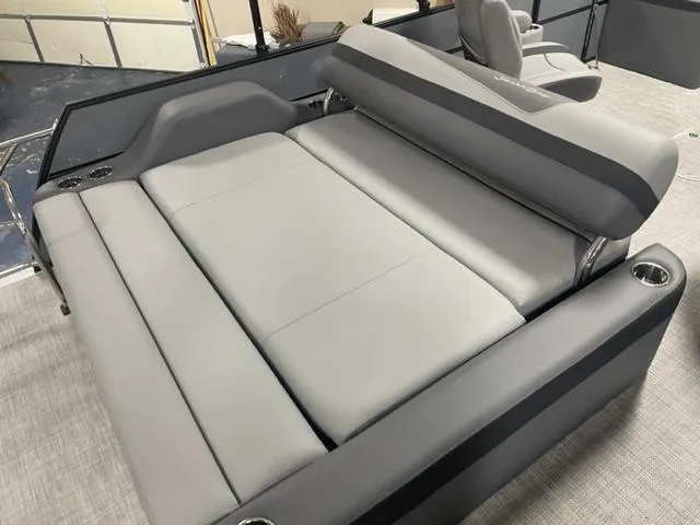 Slide: The Image of 2023 South Bay 224 UL 3.0 boat with spacious, gray cushioned seating area. - 5