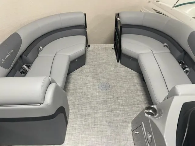 Slide: The Image of 2023 South Bay 224 UL 3.0 boat interior with gray seating and flooring. - 8