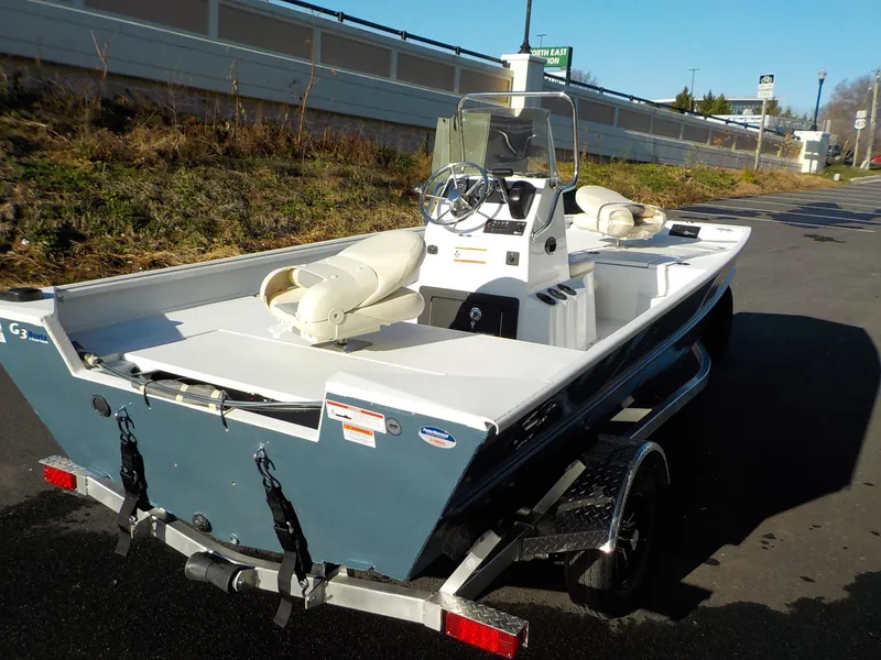 Slide: The Image of 2023 G3 Bay 17 boat on trailer, parked outdoors. - 9