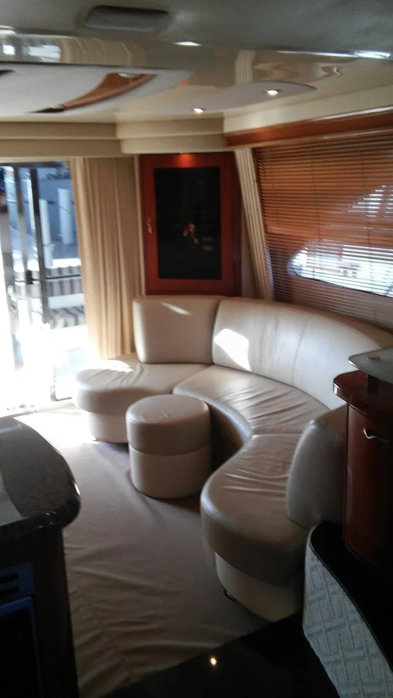 Slide: The Image of Luxurious interior of a 2005 Sea Ray 550 Sedan Bridge yacht with leather seating. - 10