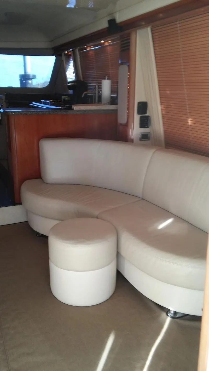 Slide: The Image of Luxurious interior of a 2005 Sea Ray 550 Sedan Bridge yacht with leather seating. - 11