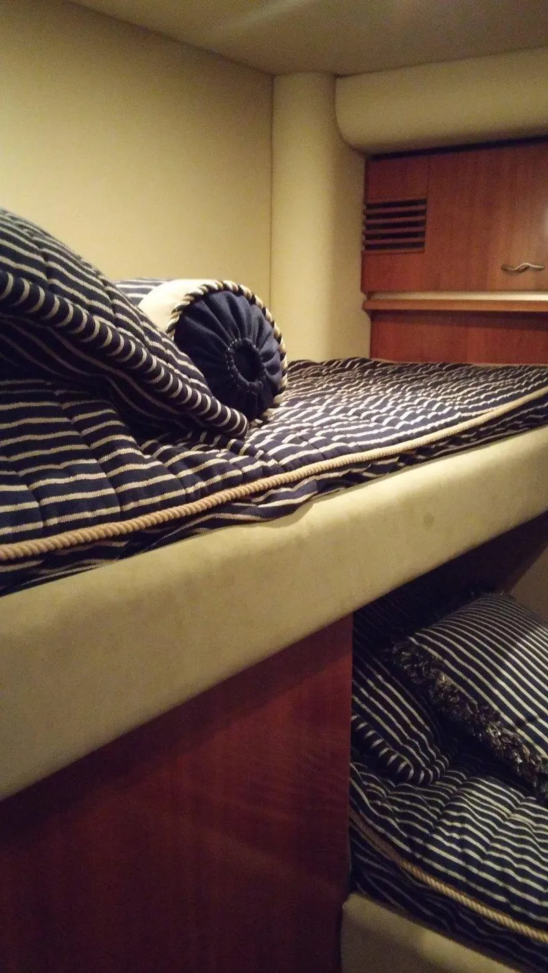 Slide: The Image of Bunk beds in the 2005 Sea Ray 550 Sedan Bridge yacht cabin. - 17