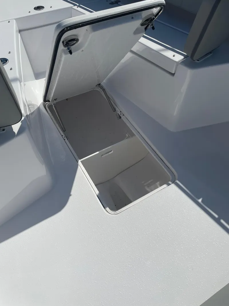Slide: The Image of Open storage compartment on a 2025 Cape Horn 34Xs boat. - 10