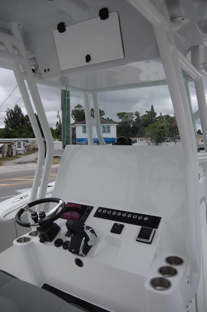 Slide: The Image of 2025 Cape Horn 34Xs boat console with steering wheel and control panel. - 14