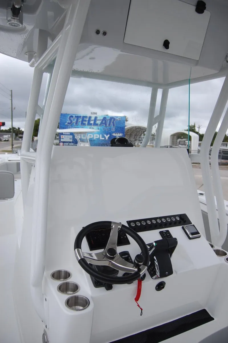 Slide: The Image of 2025 Cape Horn 34Xs boat console with steering wheel and control panel. - 15