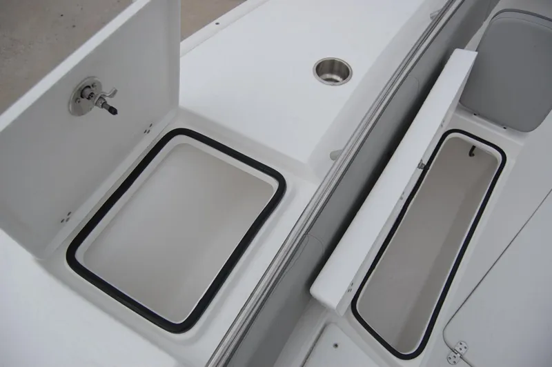 Slide: The Image of 2025 Cape Horn 34Xs boat storage compartments and cup holder. - 8