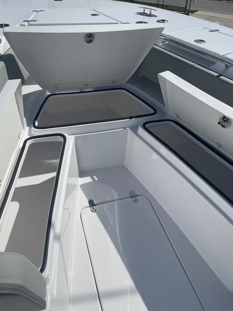 Slide: The Image of 2025 Cape Horn 34Xs boat with open storage compartments. - 9