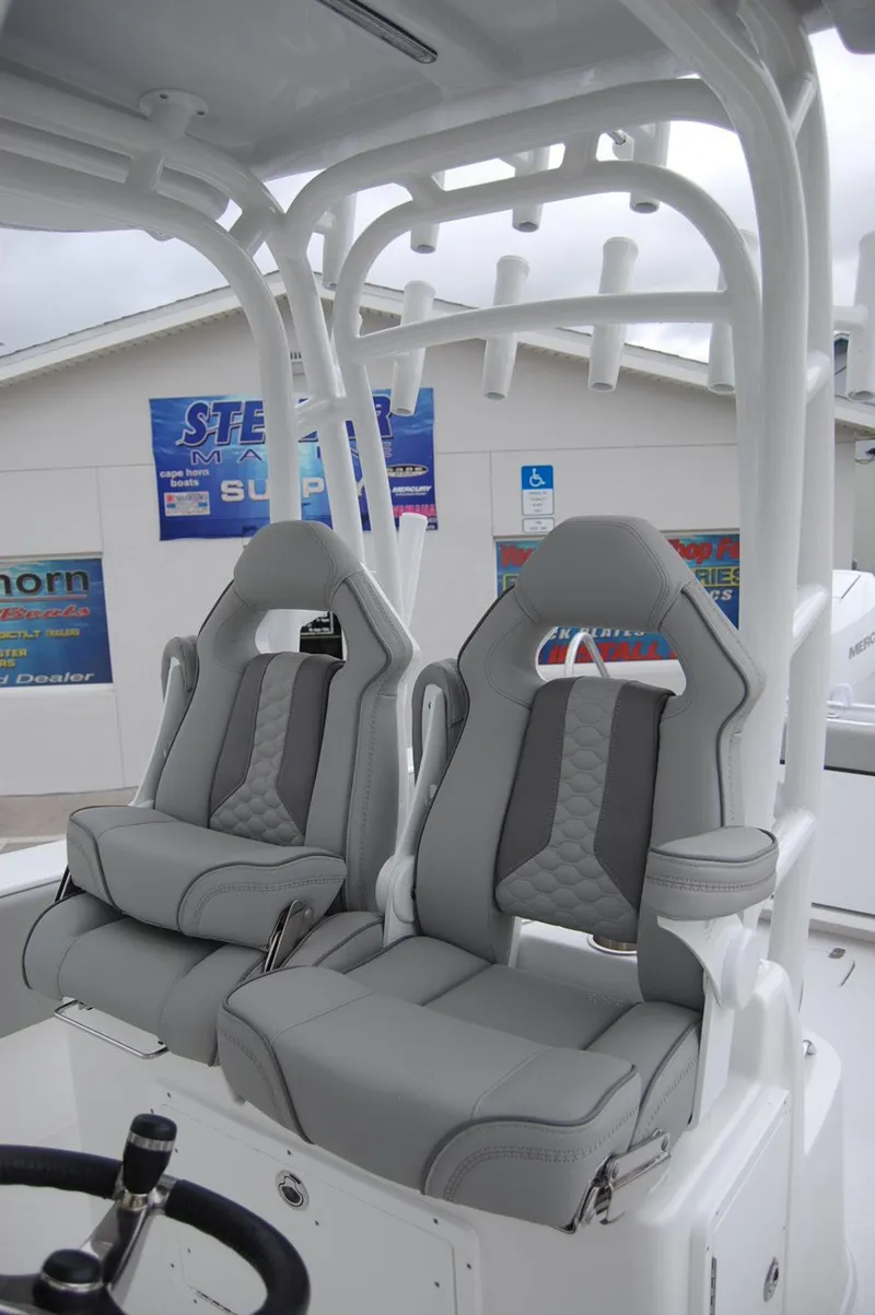 Slide: The Image of 2025 Cape Horn 34Xs boat with dual grey captain's seats and white frame. - 18