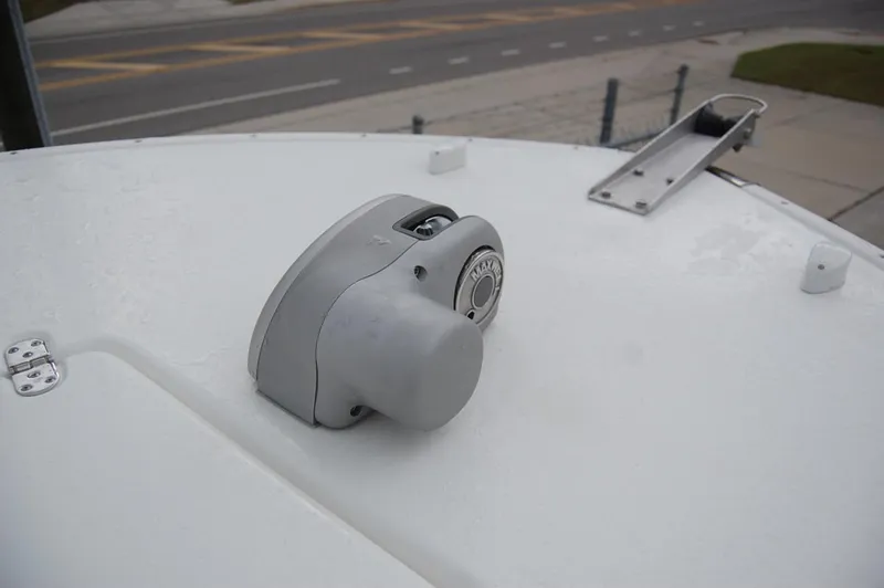 Slide: The Image of Close-up of a 2025 Cape Horn 34Xs boat deck with a mounted winch. - 4