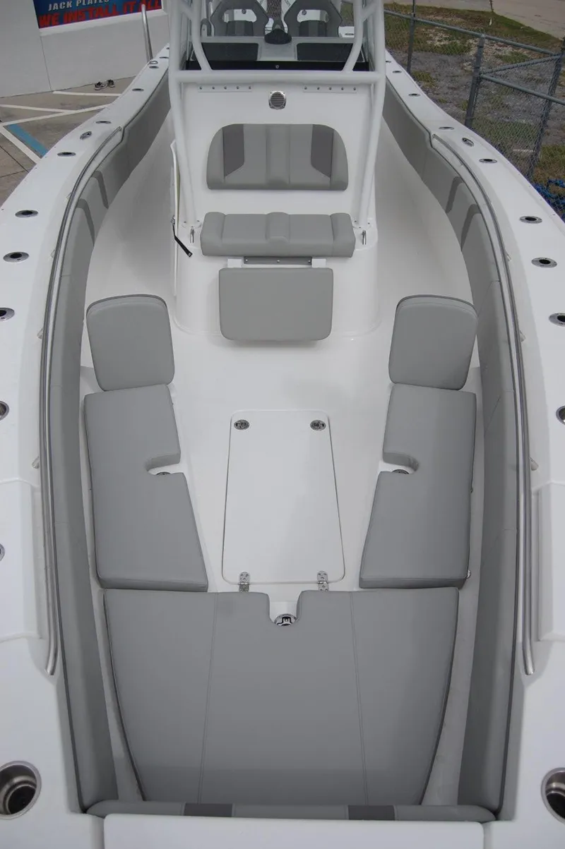 Slide: The Image of 2025 Cape Horn 34Xs boat interior with gray seating and white deck. - 5