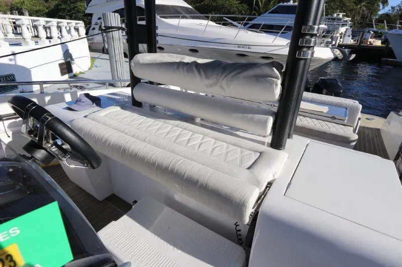 Slide: The Image of 2018 Canados Gladiator 428 boat interior with white cushioned seating. - 4