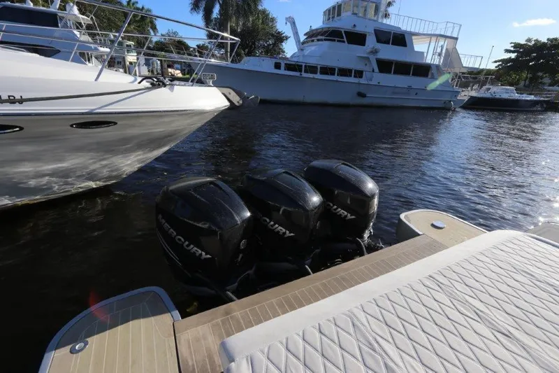 Slide: The Image of 2018 Canados Gladiator 428 with triple Mercury outboard engines docked. - 5