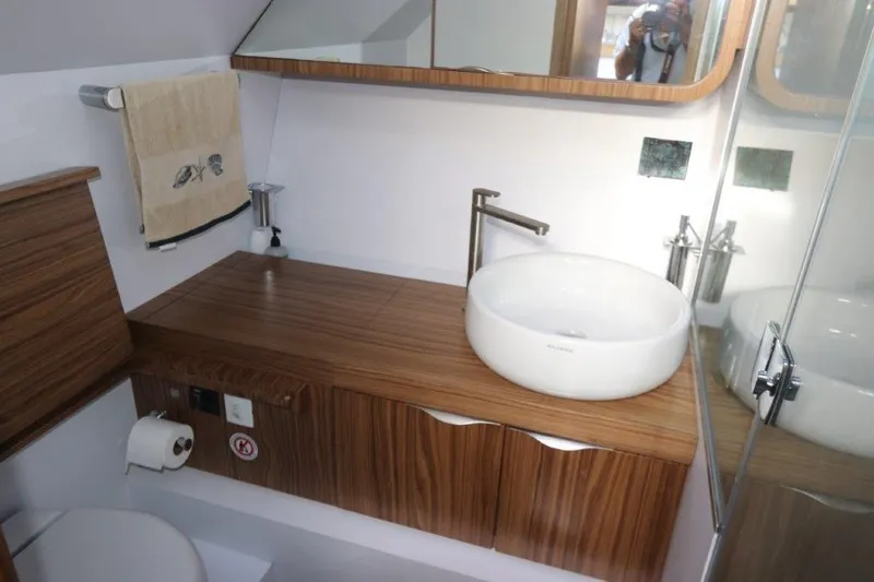 Slide: The Image of Modern bathroom in 2018 Canados Gladiator 428 yacht with wooden vanity and vessel sink. - 9