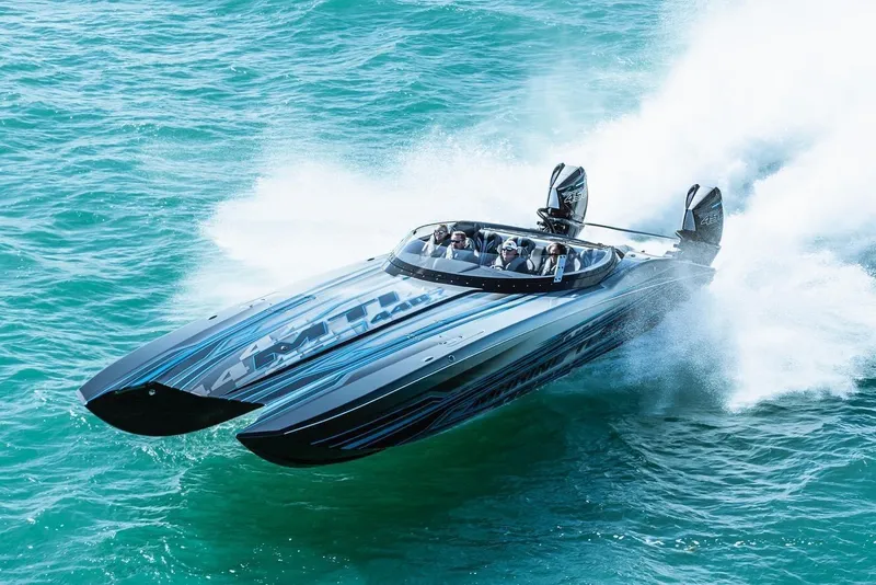 The Image of 2025 MTI 440X powerboat speeding on turquoise water. - 0