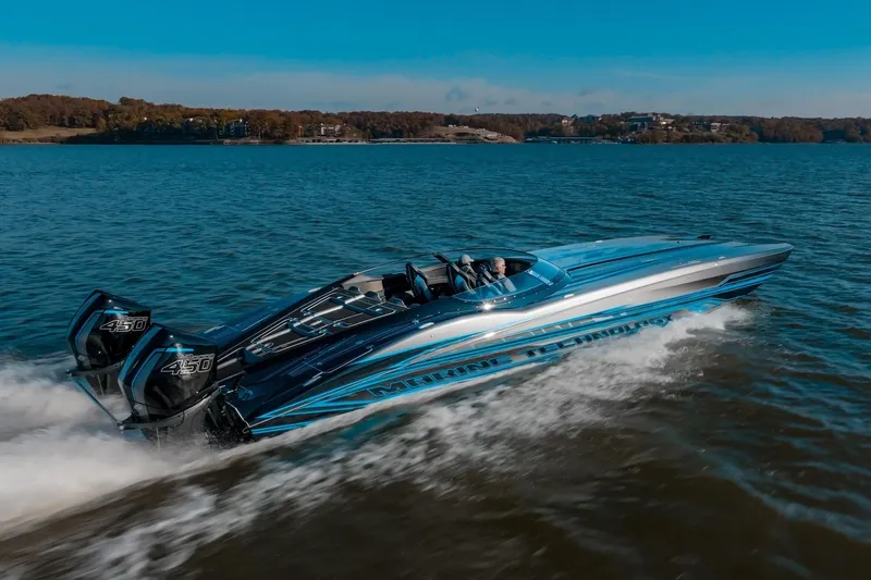 Slide: The Image of 2025 MTI 440X speedboat cruising on a lake. - 1